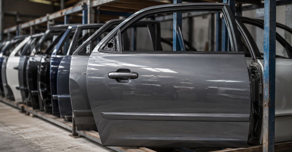 Used replacement car door on storage rack at an automotive wrecking yard in Adelaide.